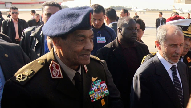 Egypt leader heckled in Tripoli over Qaddafi fugitives