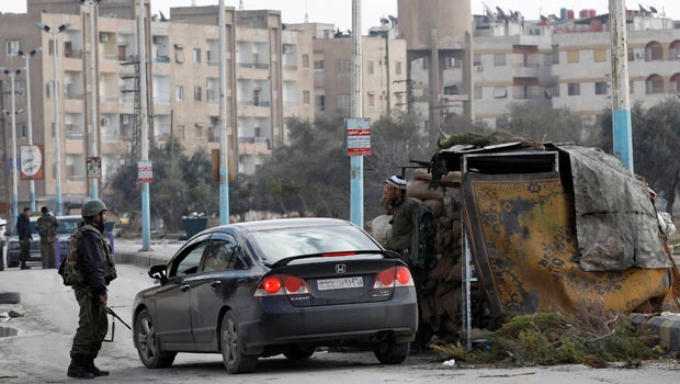 Syrian troops storm Damascus suburb