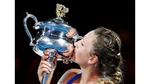 Azarenka bullies Sharapova to claim maiden major