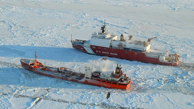 Icebreaker helping ship reach iced-in Alaska city