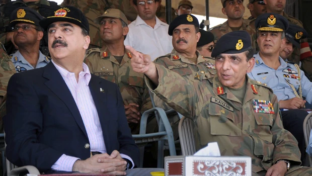 Pakistan fires defense secretary, escalating crisis