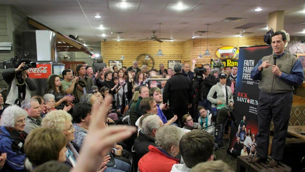Tight race in Iowa kicks off 2012 campaign