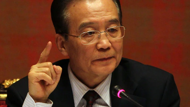Wen defends Iran oil, warns on nuclear aims
