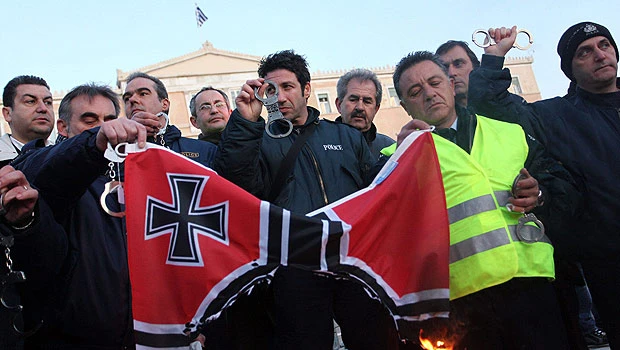 Greece cuts minimum wage as austerity drive begins