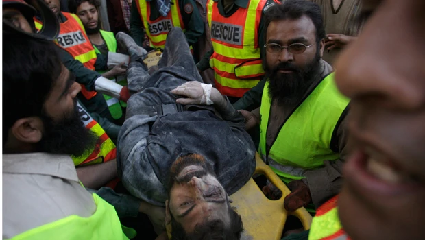Factory collapse in Pakistan kills 9, traps dozens