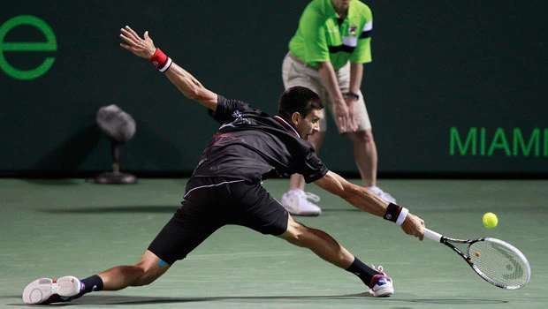 Federer, Djokovic progress; Clijsters crashes