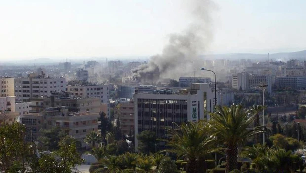 Syrian security compounds hit by deadly car bombs