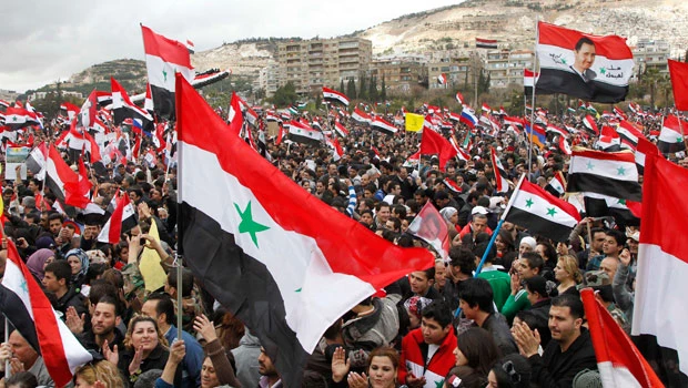 Pro-Assad rallies mark anniversary of Syria revolt