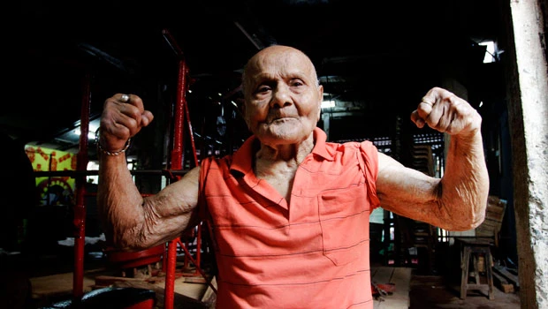 Former Mr. Universe flexes muscles at 100