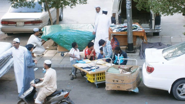 Wrecked cars being used as shops in Madinah