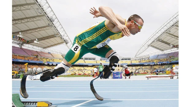 Pistorius runs qualifying time for London Olympics