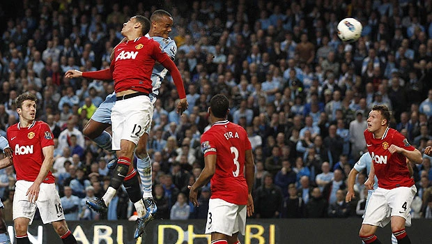 Man City eye title after Kompany sinks United