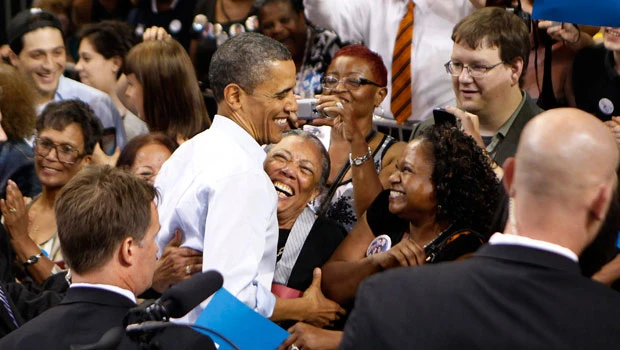 Obama plunges into campaign, tears into Romney