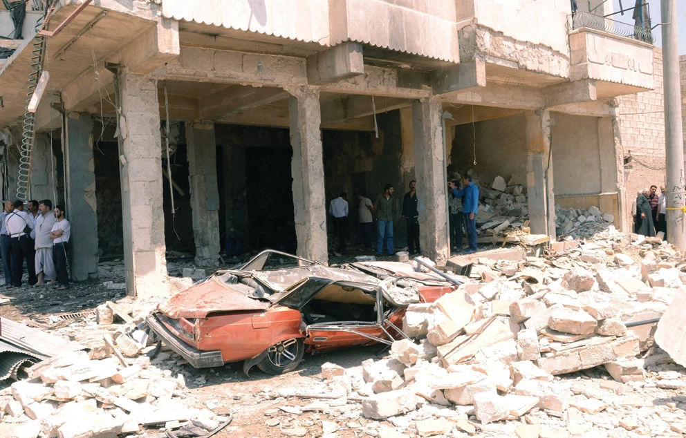 Assad troops attack mourners