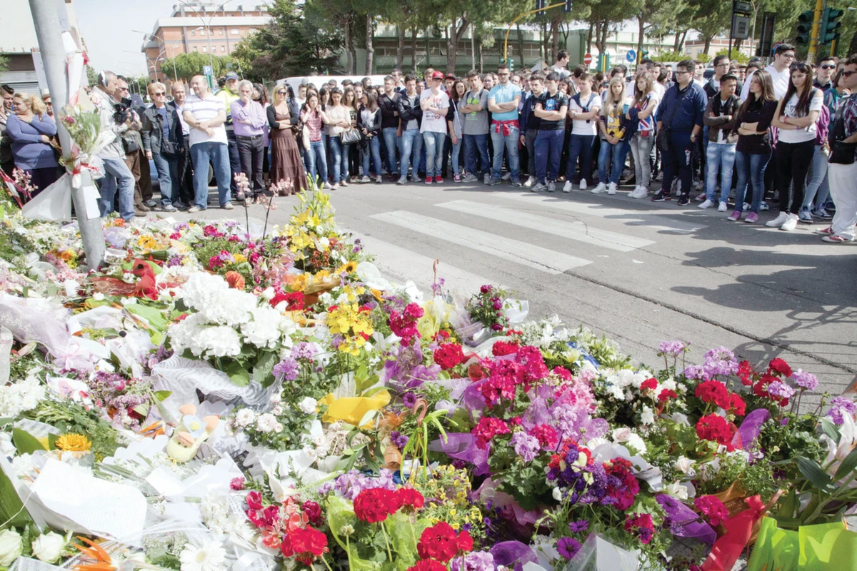 Italy bombing sparks protests as police hunt for killer