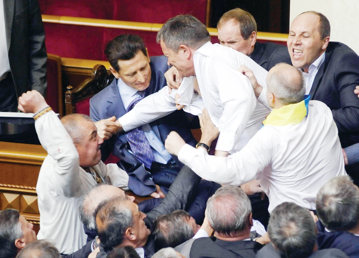 Elections called after fists of fury fly in Ukraine Parliament