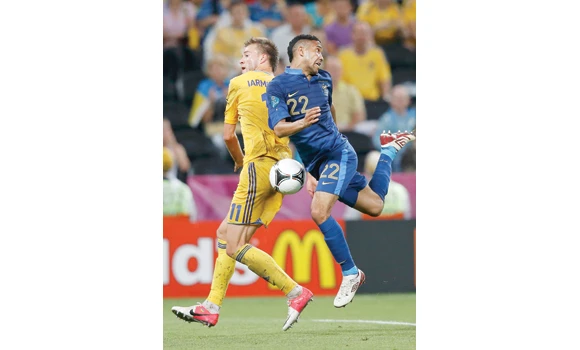 France storms past Ukraine in wet Donetsk