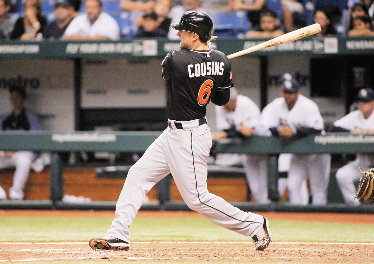 Cousins triple lifts Marlins over Rays