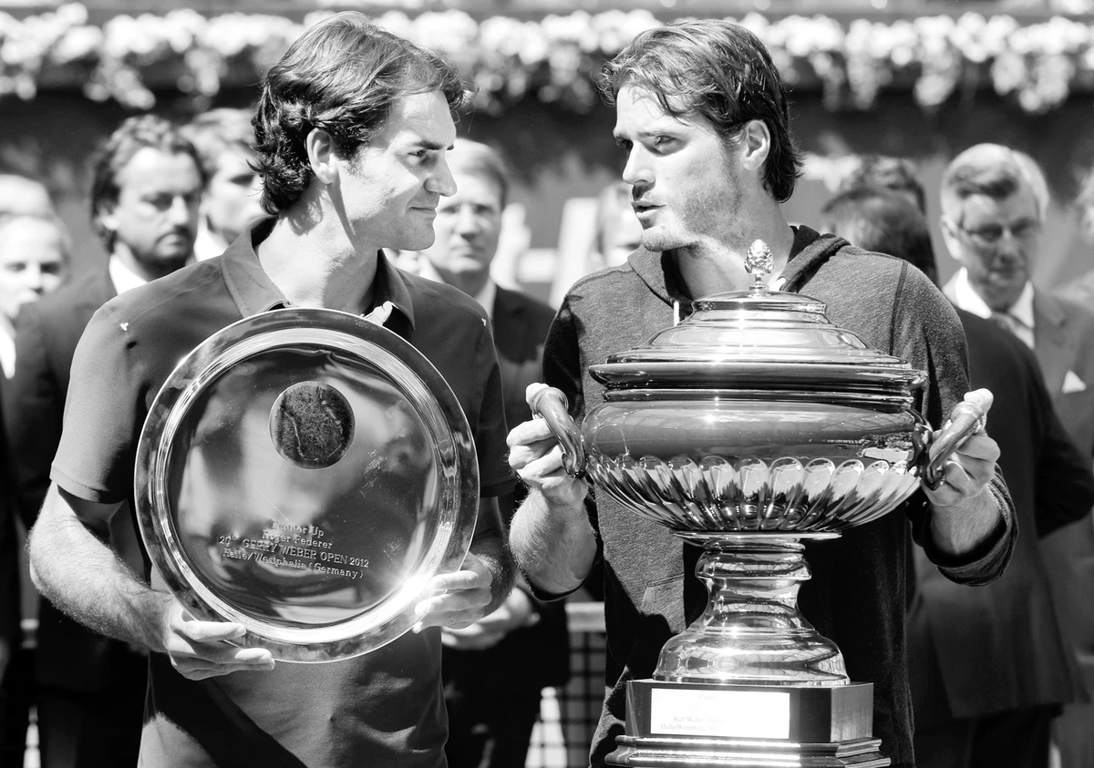Haas stuns Federer
to win Halle title