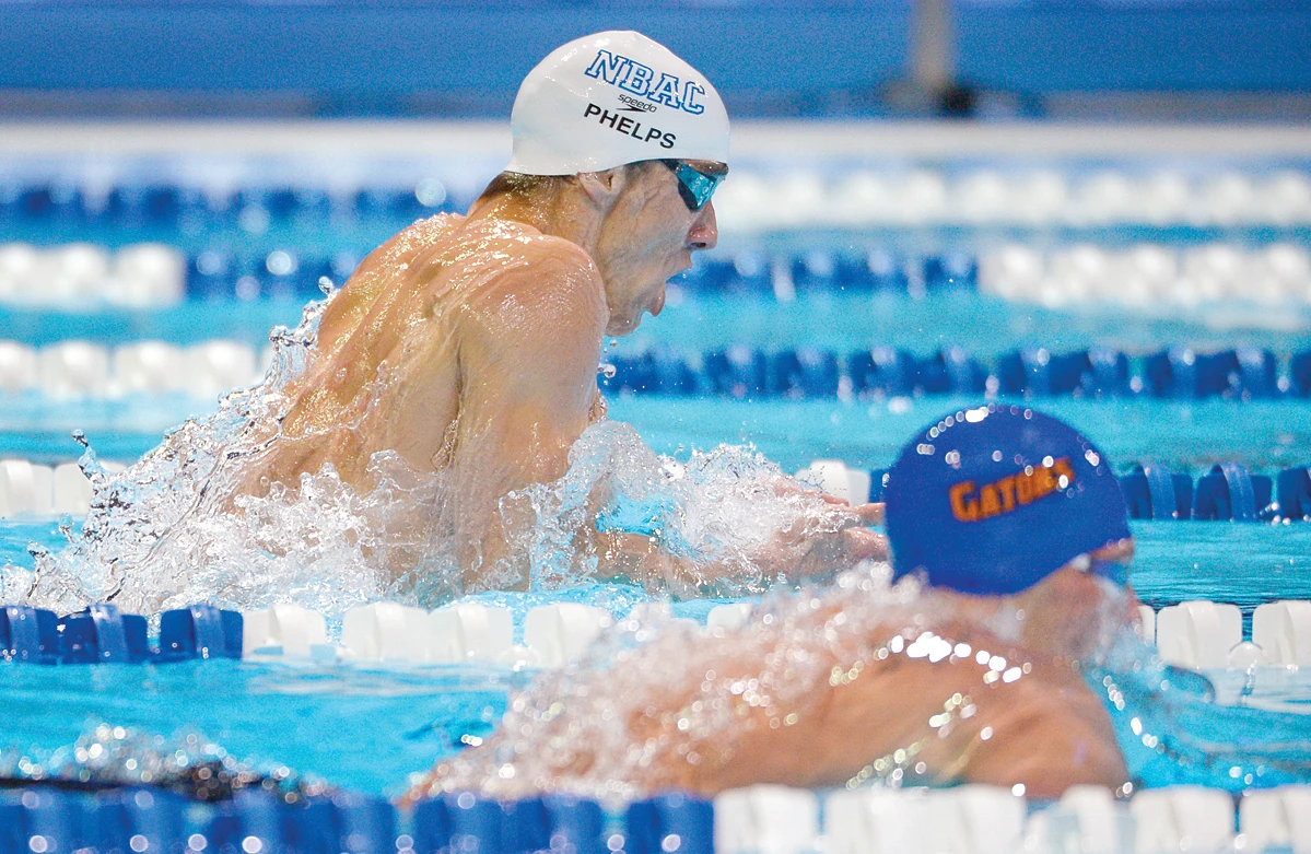 Birthday boy Phelps beats Lochte