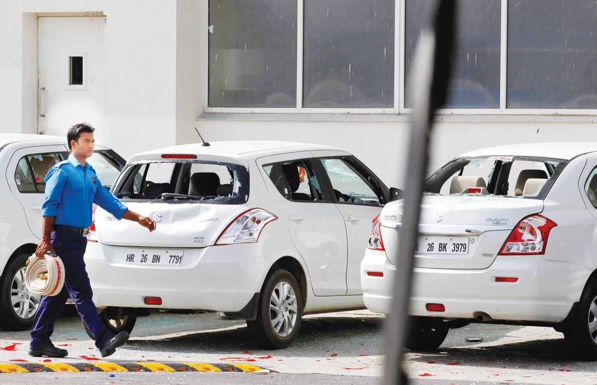 Maruti shares sink after deadly riot shuts car factory