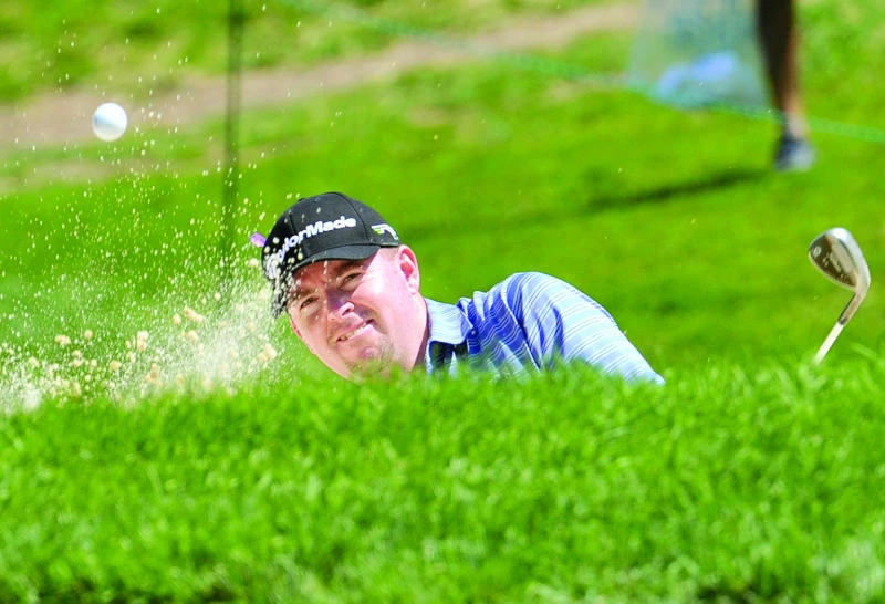 Garrigus sets record, takes lead in Canada