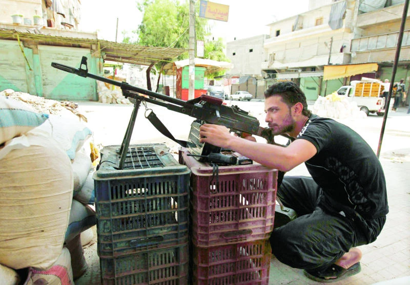 Syrian fighters seek heavy arms as Assad unleashes 'killing machine'