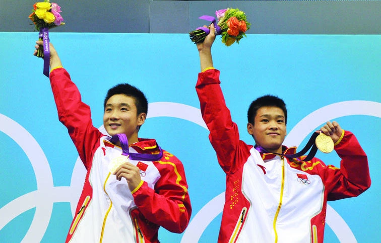 China stretches medal haul as ticket row rumbles on