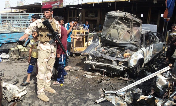 Iraq market bomb kills 25, hours after pilgrims hit