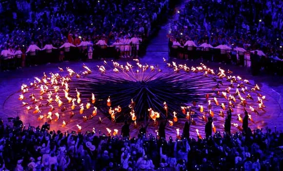 Seven teenagers light Games’ cauldron, games begin