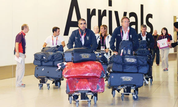 Athletes arrive in London, airport under pressure
