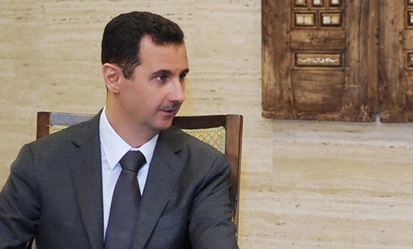 Assad praises troops but his whereabouts are mystery