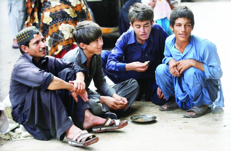 Afghan scavengers in Karachi tread on dangerous ground