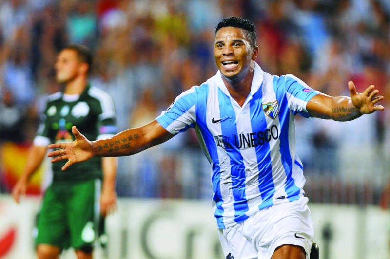 Malaga seizes control in Champions League playoff