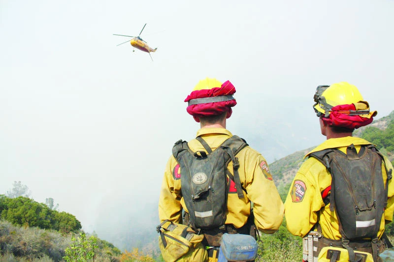 California declares emergency as wildfire advances on town