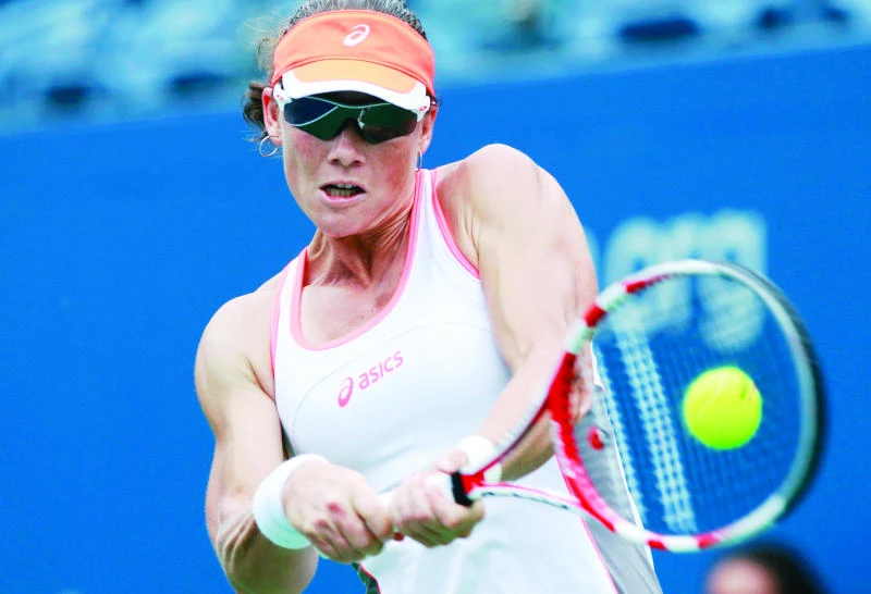 Stosur triumphs; rain halts play at US Open