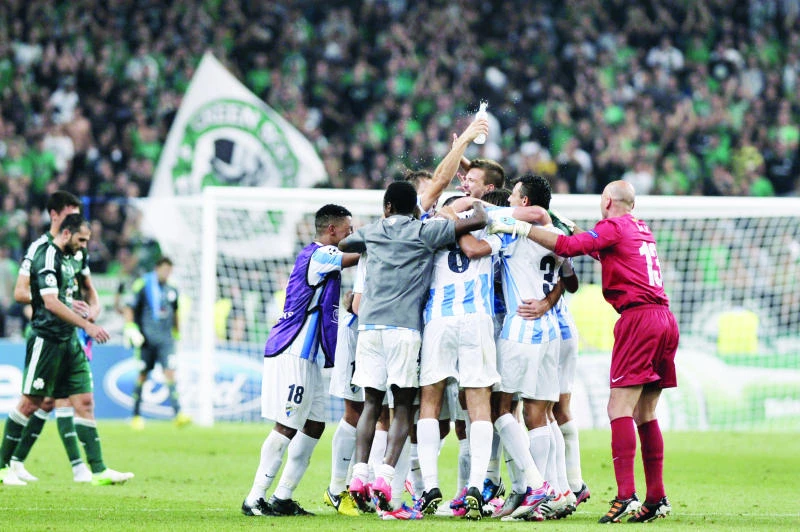 Malaga books spot in Champions League
