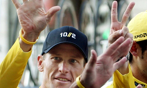 Armstrong ends fight against doping charges, titles at risk