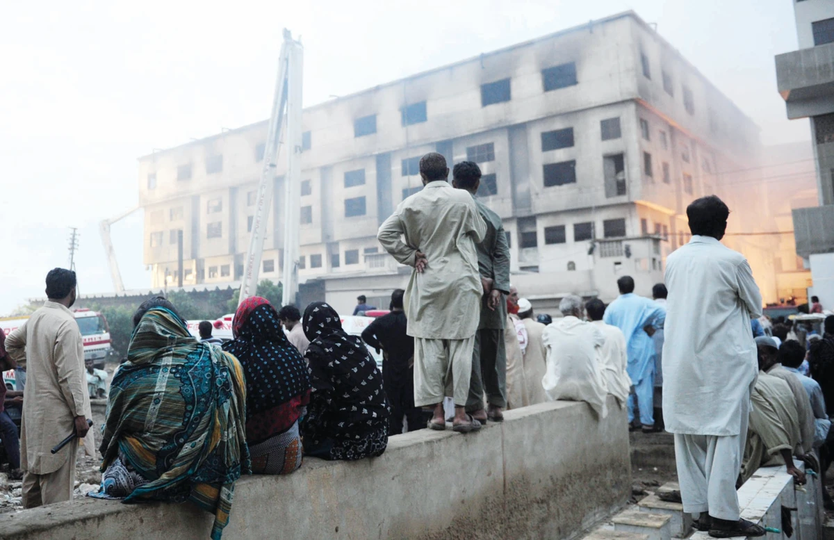 Pakistan factory fires kill 310