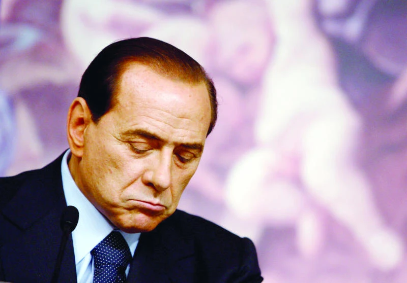 Beleaguered Berlusconi makes return to politics