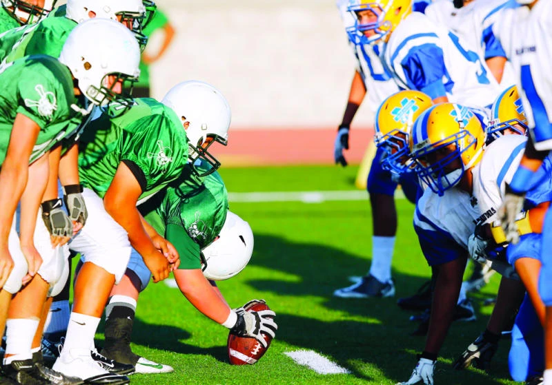 US high school football moving to save brains as game goes on