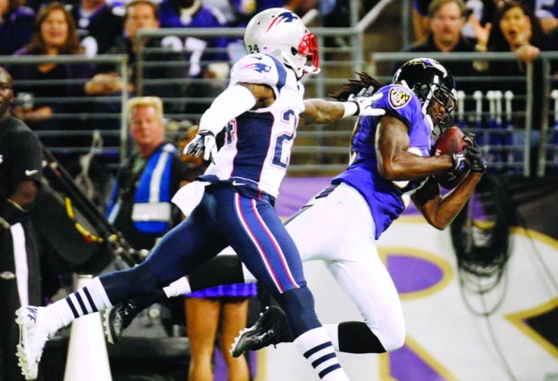 Grieving Smith sparks Ravens over Patriots