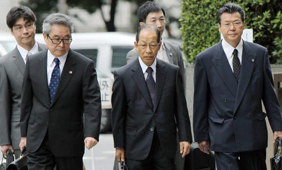 Olympus, former executives plead guilty