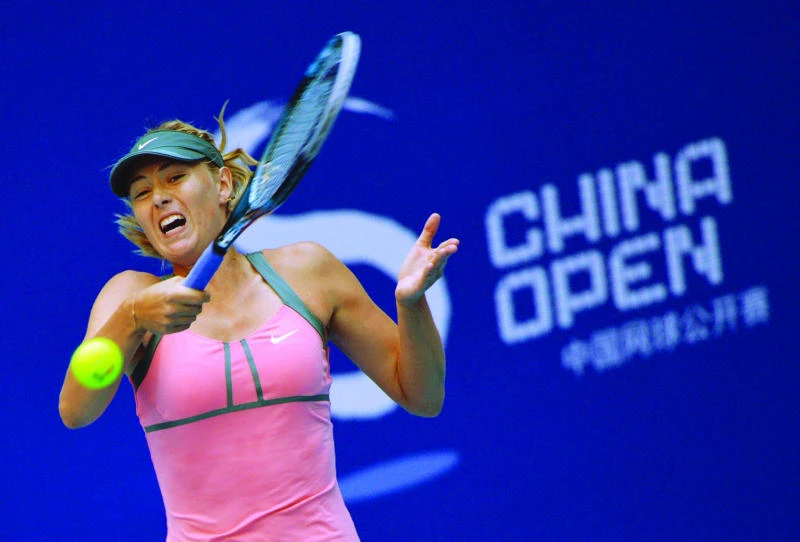 Djokovic, Sharapova on course in Beijing