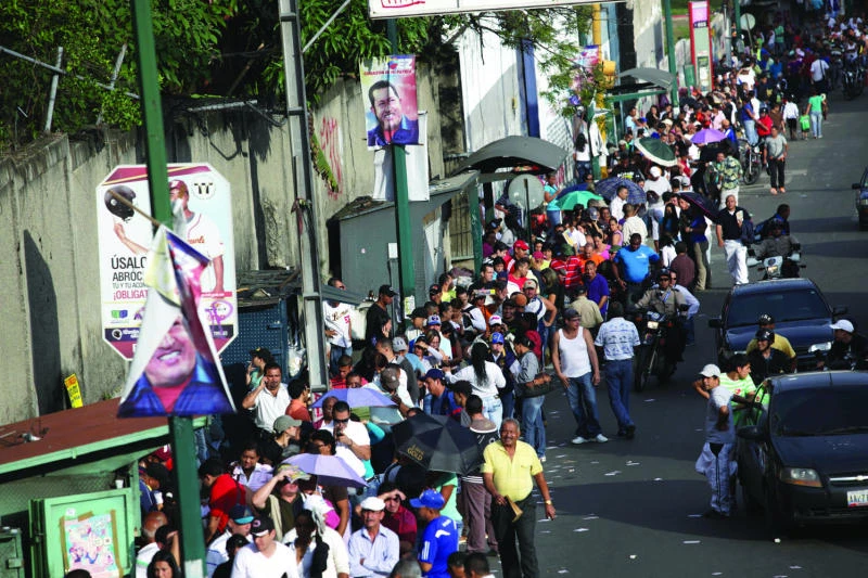 Venezuelans vote in Chavez’s toughest election yet