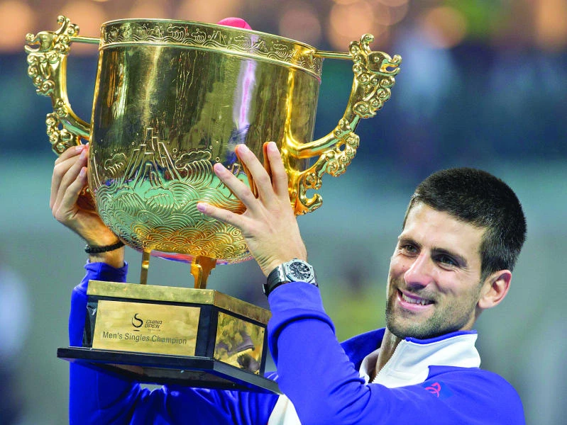 Djokovic, Azarenka reign in Beijing