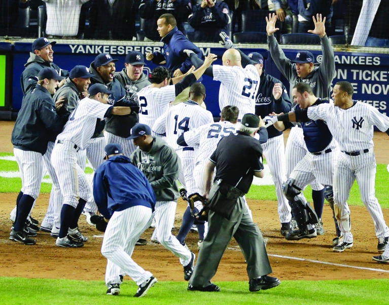 Yankees, A’s rally late to win playoff thrillers