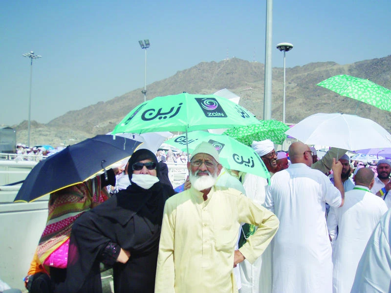 Multicolored umbrellas provide the ultimate shade to pilgrims