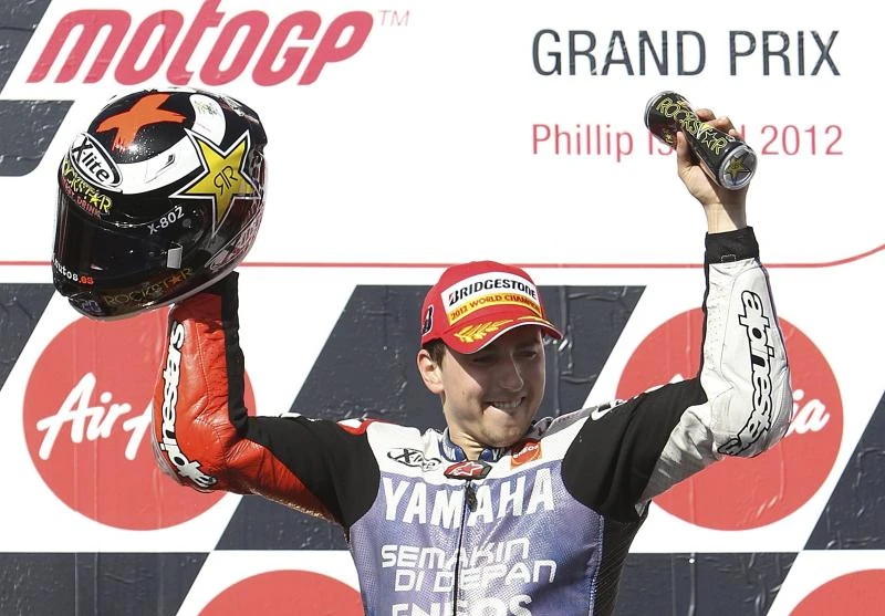 Pedrosa tumble hands Lorenzo motorcycling world title