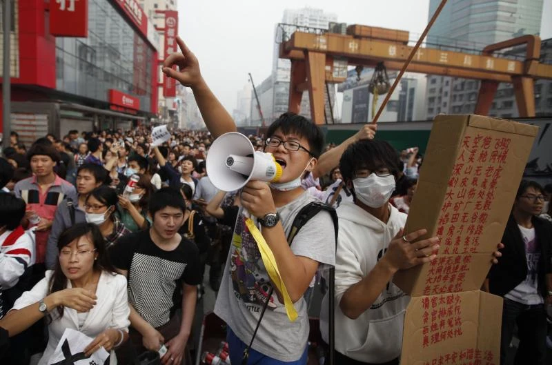 China halts chemical plant following riots